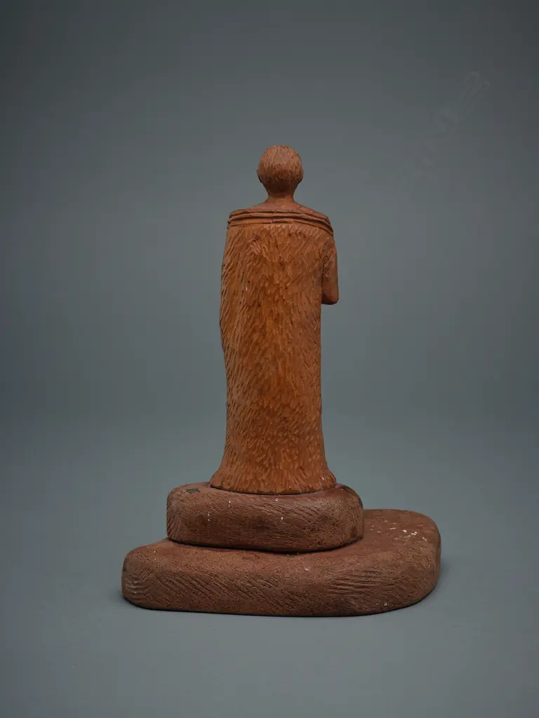 Wooden figure of a Māori rangatira holding patu, Image 1++